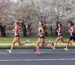 WASHINGTON, DC - March 8: From left, Susanna Sullivan (#22), Paige Stoner (#18), Sarah Pagano (#10) ,  Carrie Verdon (#16), Kim Conley (#14) run in the 2022 Cherry Blossom Ten Mile Run. Sullivan finished first in the race. (Photo by Dani Seiss/The Washington Post)